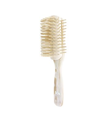 Big disassembled brush with long wooden pins pearly white